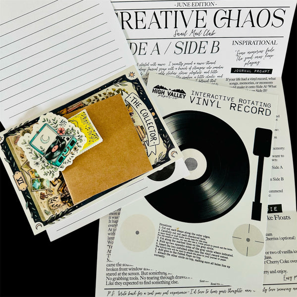 Decorative vinyl record with a cover and magazine titled 'Creative Ghaos' on a black background